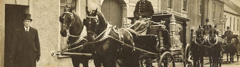 men with horses and carriage